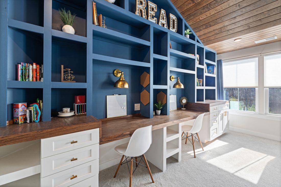 A built-in study with desks and shelving